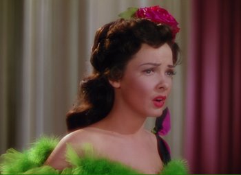 Movie still from “Show Boat” (1951), directed by George Sidney – A woman with a rose in her hair; Close Up shot, Over the shoulder angle