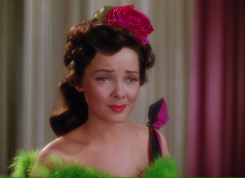 Movie still from “Show Boat” (1951), directed by George Sidney – A person wearing a dress; Close Up shot, Over the shoulder angle