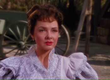 Movie still from “Show Boat” (1951), directed by George Sidney – A person wearing a dress; Close Up shot, Over the shoulder angle