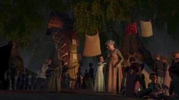 Movie still from “Shrek” (2001), directed by Vicky Jenson – A group of people standing around a tree; Wide shot, Over the shoulder angle
