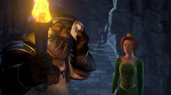 Movie still from “Shrek” (2001), directed by Vicky Jenson – A man and a woman are standing next to each other; Medium shot, High angle
