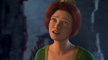 Movie still from “Shrek” (2001), directed by Vicky Jenson – An animated woman in a green dress and a crown; Close Up shot, Over the shoulder angle