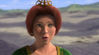 Movie still from “Shrek” (2001), directed by Vicky Jenson – A woman with red hair wearing a green dress; Close Up shot, High angle
