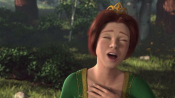Movie still from “Shrek” (2001), directed by Vicky Jenson – An animated picture of a woman in a green dress; Close Up shot, Low angle
