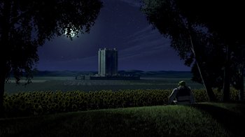 Movie still from “Shrek” (2001), directed by Vicky Jenson – A person sitting on a field of sunflowers at night; Extreme Wide shot, Low angle