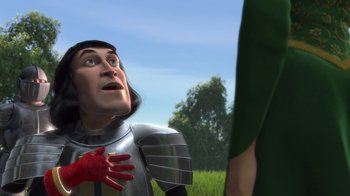Movie still from “Shrek” (2001), directed by Vicky Jenson – A man in a suit of armor is talking to a woman; Close Up shot, Over the shoulder angle