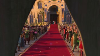 Movie still from “Shrek 2” (2004), directed by Andrew Adamson – A crowd of people standing around a red carpet; Extreme Wide shot, Over the shoulder angle
