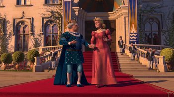 Movie still from “Shrek 2” (2004), directed by Andrew Adamson – A couple of people standing on a red carpet; Wide shot, High angle