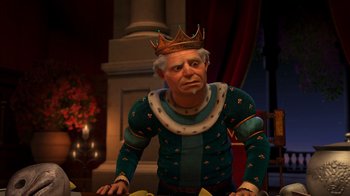 Movie still from “Shrek 2” (2004), directed by Andrew Adamson – An old man wearing a crown is sitting at a table; Medium shot, Over the shoulder angle