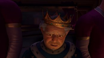 Movie still from “Shrek 2” (2004), directed by Andrew Adamson – An old man wearing a golden crown and a blue robe; Close Up shot, High angle
