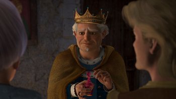 Movie still from “Shrek 2” (2004), directed by Andrew Adamson – A man wearing a crown and holding a bottle; Close Up shot, High angle