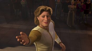 Movie still from “Shrek 2” (2004), directed by Andrew Adamson – A man with long brown hair is smiling; Medium shot, High angle