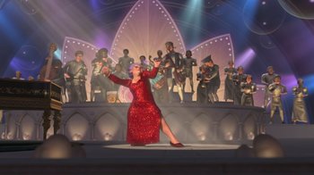 Movie still from “Shrek 2” (2004), directed by Andrew Adamson – A woman in a long red dress on a stage; Extreme Wide shot, Low angle