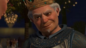 Movie still from “Shrek 2” (2004), directed by Andrew Adamson – An old man wearing a gold crown and a blue shirt; Close Up shot, Over the shoulder angle