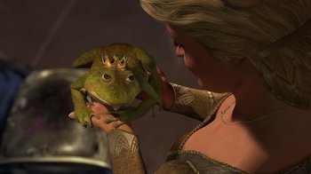 Movie still from “Shrek 2” (2004), directed by Andrew Adamson – A woman holding a frog with a crown on it's head; Close Up shot, Over the shoulder angle
