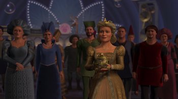 Movie still from “Shrek 2” (2004), directed by Andrew Adamson – A group of people dressed in costumes with a woman in a gold dress; Medium shot, Over the shoulder angle