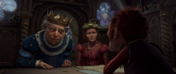 Movie still from “Shrek Forever After” (2010), directed by Mike Mitchell – A group of people sitting around a table; Medium shot, Over the shoulder angle