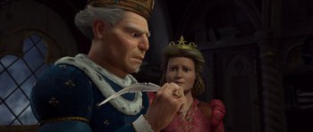Movie still from “Shrek Forever After” (2010), directed by Mike Mitchell – An old man and a young woman are looking at something; Close Up shot, Over the shoulder angle