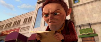 Movie still from “Shrek Forever After” (2010), directed by Mike Mitchell – An animated character holding a piece of paper in his hands; Medium shot, High angle