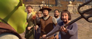 Movie still from “Shrek Forever After” (2010), directed by Mike Mitchell – A group of people standing next to each other; Medium shot, High angle