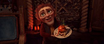 Movie still from “Shrek Forever After” (2010), directed by Mike Mitchell – An animated character holding a plate with a tomato on top of it; Medium shot, High angle