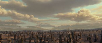 Movie still from “Shrek Forever After” (2010), directed by Mike Mitchell – An image of a desert scene with trees in the background; Extreme Wide shot, High angle