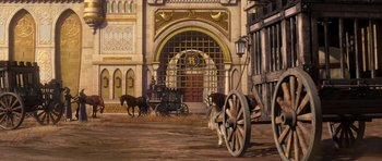 Movie still from “Shrek Forever After” (2010), directed by Mike Mitchell – An old fashioned horse drawn carriage in front of a building; Extreme Wide shot, Low angle