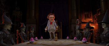 Movie still from “Shrek Forever After” (2010), directed by Mike Mitchell – A cartoon of a man standing in front of a group of people; Wide shot, Low angle