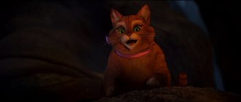 Movie still from “Shrek Forever After” (2010), directed by Mike Mitchell – An orange cat with a pink collar sitting on the ground; Close Up shot, High angle