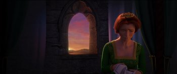 Movie still from “Shrek Forever After” (2010), directed by Mike Mitchell – A red haired woman in a green dress in front of a window; Medium shot, Over the shoulder angle