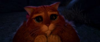 Movie still from “Shrek Forever After” (2010), directed by Mike Mitchell – An orange cat with blue eyes sitting on top of a floor; Close Up shot, High angle