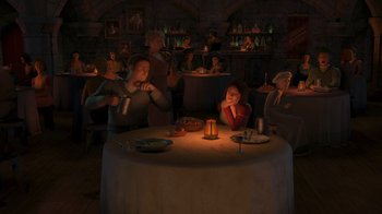 Movie still from “Shrek the Third” (2007), directed by Raman Hui – A group of people sitting around a table with a lit candle; Wide shot, High angle