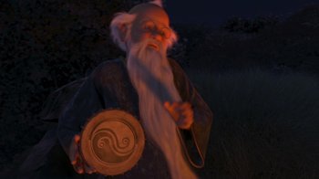 Movie still from “Shrek the Third” (2007), directed by Raman Hui – An old man with a long white beard holding an object in front of him; Medium shot, Over the shoulder angle