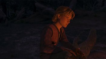 Movie still from “Shrek the Third” (2007), directed by Raman Hui – A person sitting in the dark near a tree; Medium shot, Over the shoulder angle