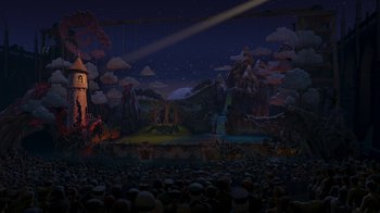 Movie still from “Shrek the Third” (2007), directed by Raman Hui – A large crowd is gathered around a stage; Extreme Wide shot, High angle