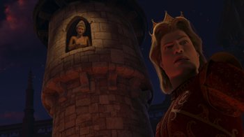 Movie still from “Shrek the Third” (2007), directed by Raman Hui – A man standing in front of a tower with a statue in the background; Medium shot, Low angle