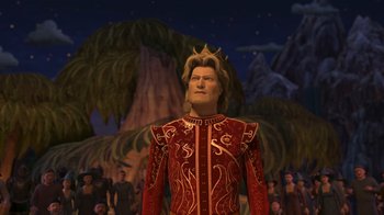 Movie still from “Shrek the Third” (2007), directed by Raman Hui – A man wearing a red outfit and a gold crown; Medium shot, High angle