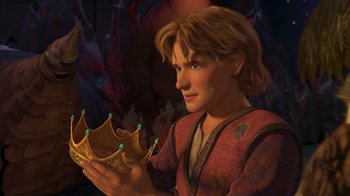 Movie still from “Shrek the Third” (2007), directed by Raman Hui – A young man holding a crown in his hands; Close Up shot, High angle