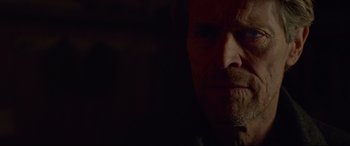 Movie still from “Siberia” (2020), directed by Abel Ferrara – A man's face in the dark; Close Up shot, Over the shoulder angle