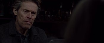 Movie still from “Siberia” (2020), directed by Abel Ferrara – A person sitting in front of a camera; Close Up shot, Over the shoulder angle