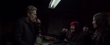 Movie still from “Siberia” (2020), directed by Abel Ferrara – A man and a woman are sitting at a table drinking wine; Medium shot, Over the shoulder angle