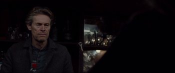 Movie still from “Siberia” (2020), directed by Abel Ferrara – A man holding a wrench in a dark room; Close Up shot, Over the shoulder angle