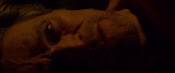 Movie still from “Siberia” (2020), directed by Abel Ferrara – A man's face with a beard; Extreme Close Up shot, Overhead angle