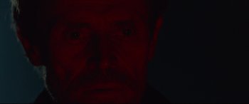 Movie still from “Siberia” (2020), directed by Abel Ferrara – A man's face in the dark; Close Up shot, Low angle