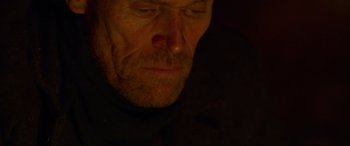 Movie still from “Siberia” (2020), directed by Abel Ferrara – A man's face in the dark; Close Up shot, Low angle