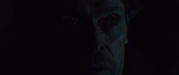 Movie still from “Siberia” (2020), directed by Abel Ferrara – A man's face with a light shining on it; Extreme Close Up shot, Low angle