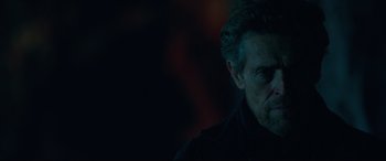 Movie still from “Siberia” (2020), directed by Abel Ferrara – A person wearing a black shirt; Close Up shot, Over the shoulder angle