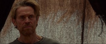 Movie still from “Siberia” (2020), directed by Abel Ferrara – A person wearing a shirt; Close Up shot, Low angle