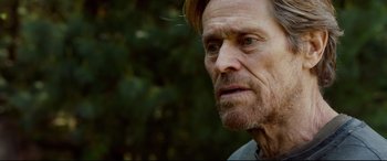 Movie still from “Siberia” (2020), directed by Abel Ferrara – An old man with a beard and a mustache; Close Up shot, Over the shoulder angle