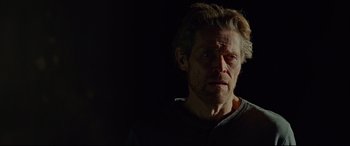 Movie still from “Siberia” (2020), directed by Abel Ferrara – A person wearing a shirt; Close Up shot, Low angle